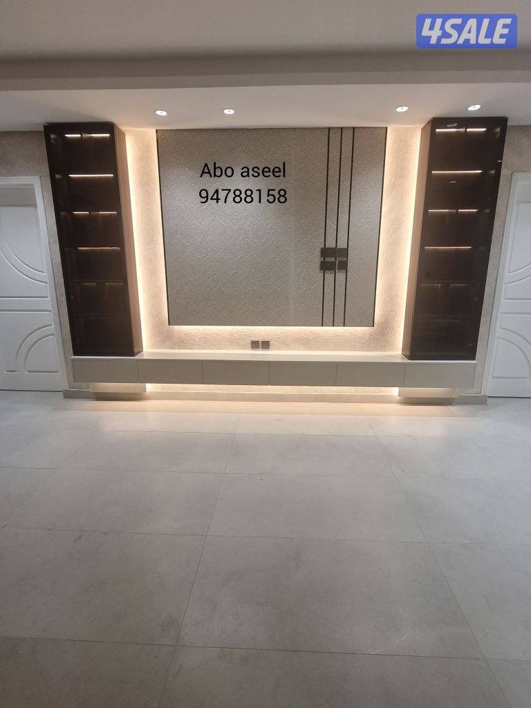 ديكورات وأصباغ وباركيه وصفائح حجريه وورق جدران0