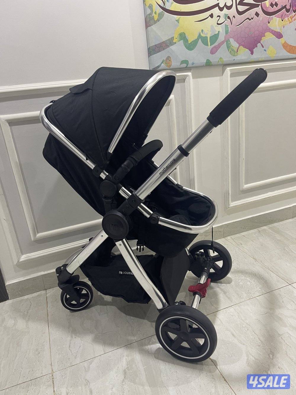 عربانه اطفال شاريتها جديدة مستخدمتها ٣ مرات فقط عربانه مع كرسي سيارة0