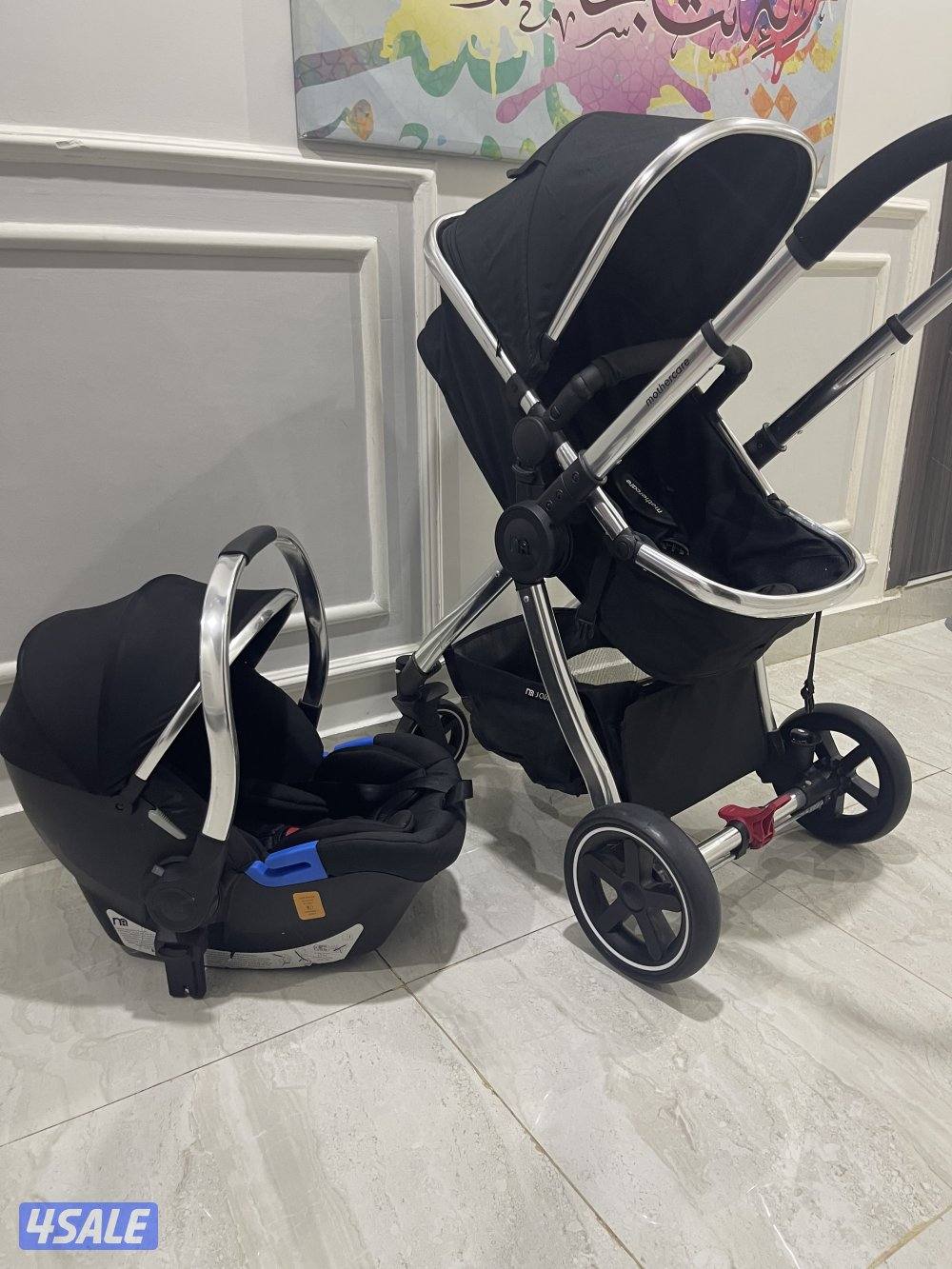 عربانه اطفال شاريتها جديدة مستخدمتها ٣ مرات فقط عربانه مع كرسي سيارة1