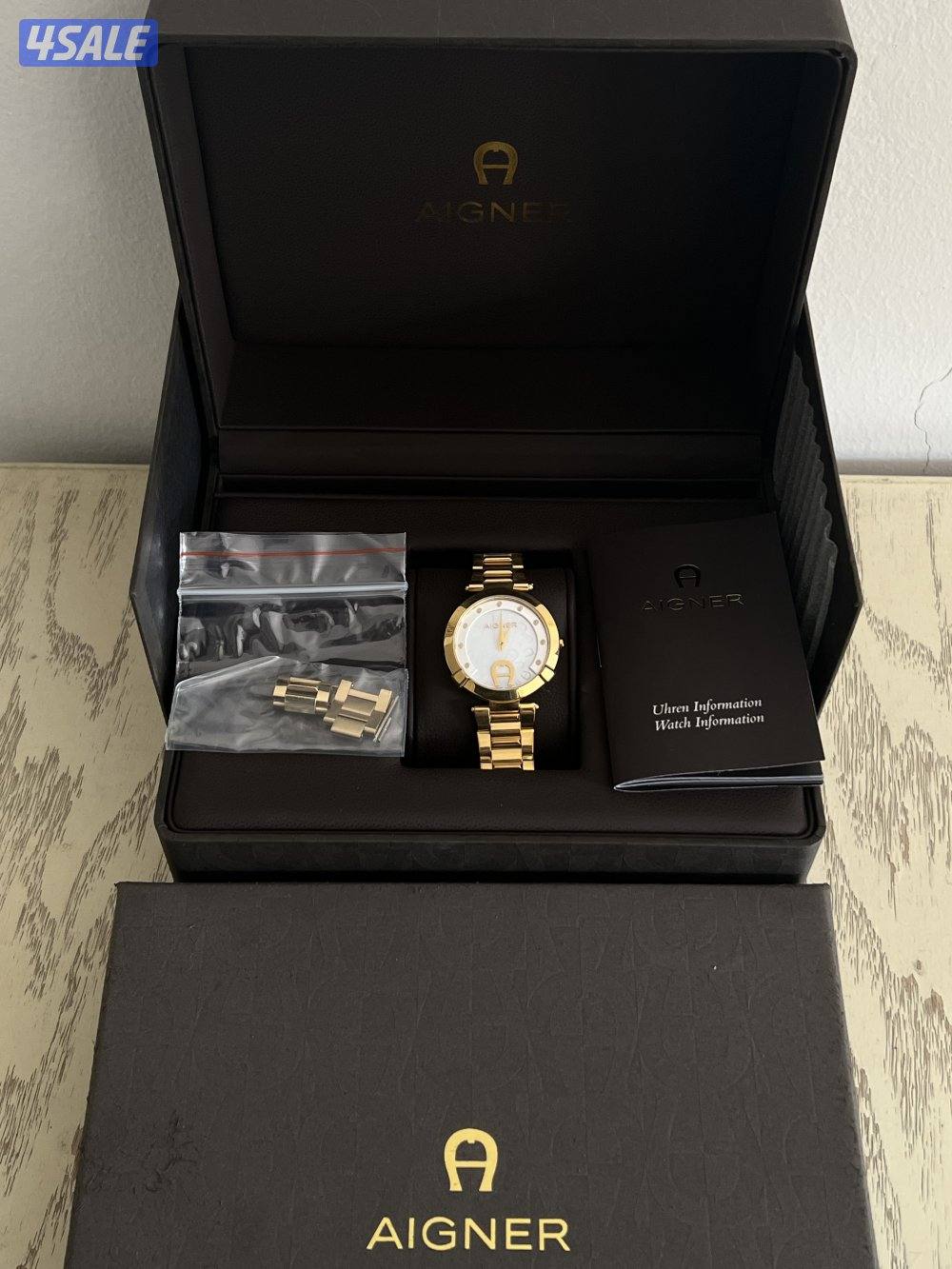 ساعه نسائيه ماركة (أغنر) الاصليه كامله بجميع مرفقاتها.1