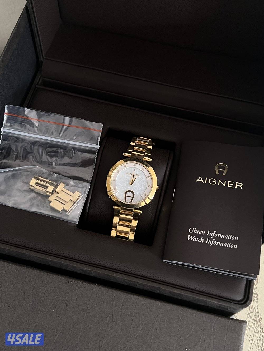 ساعه نسائيه ماركة (أغنر) الاصليه كامله بجميع مرفقاتها.6