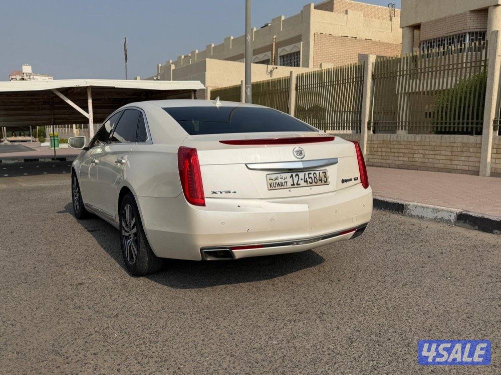 بيعه سريعه للبيع كاديلاك XTSموديل 2013 شرط الفحص ماشي ٢٢٠3