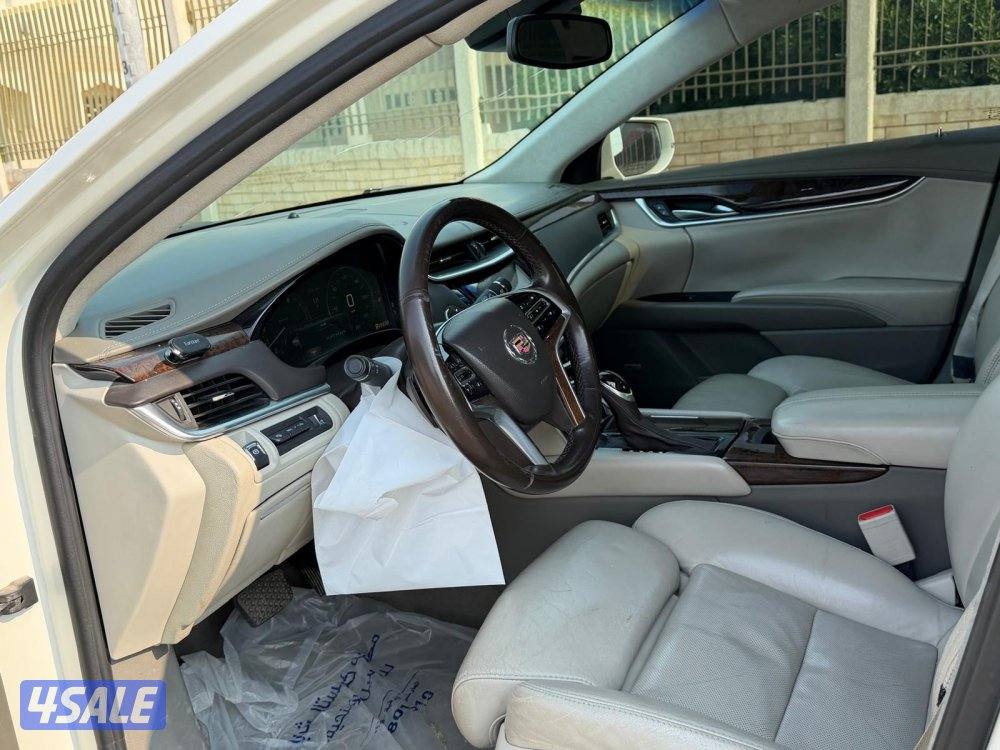 بيعه سريعه للبيع كاديلاك XTSموديل 2013 شرط الفحص ماشي ٢٢٠4