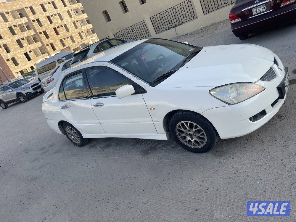للبيع سيارة ميتسوبيشى لانسر 2004 لون ابيض1