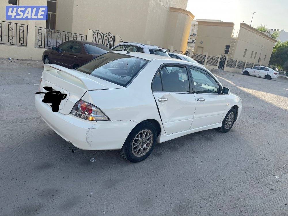 للبيع سيارة ميتسوبيشى لانسر 2004 لون ابيض3