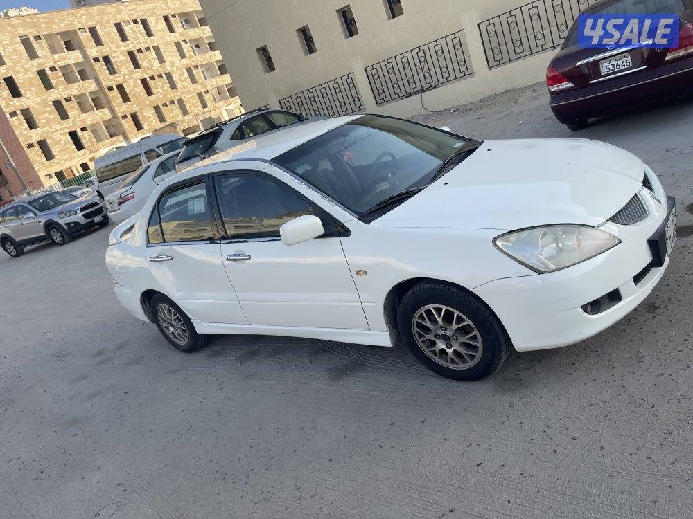 للبيع سيارة ميتسوبيشى لانسر 2004 لون ابيض4