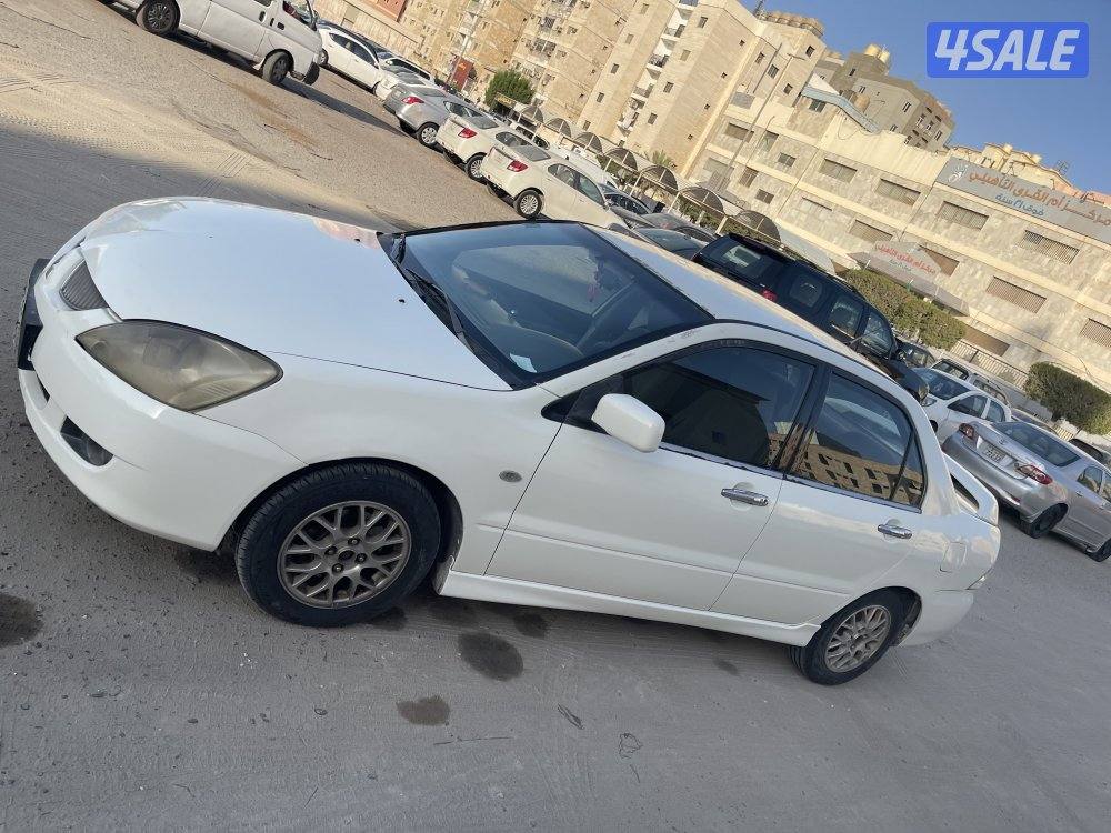 للبيع سيارة ميتسوبيشى لانسر 2004 لون ابيض6
