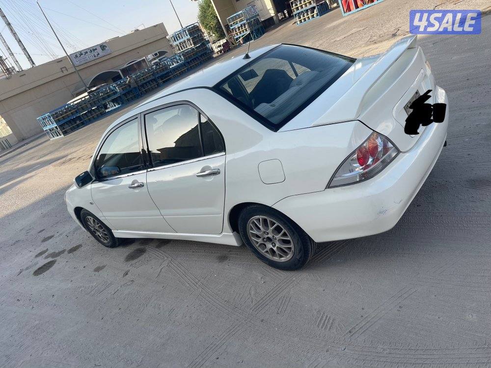 للبيع سيارة ميتسوبيشى لانسر 2004 لون ابيض9