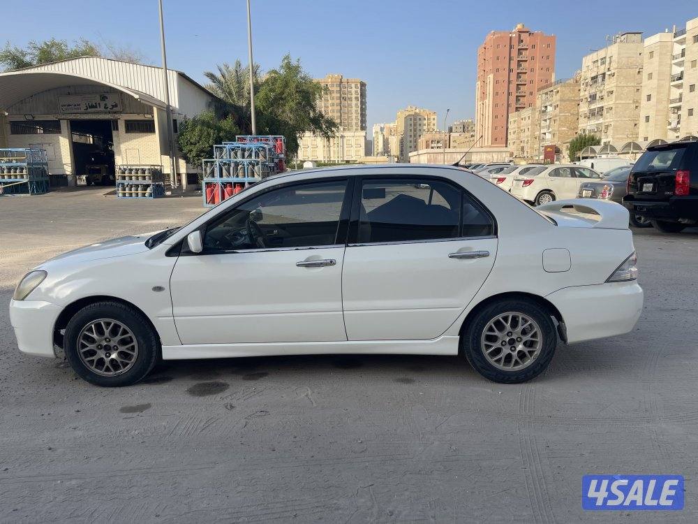 للبيع سيارة ميتسوبيشى لانسر 2004 لون ابيض13
