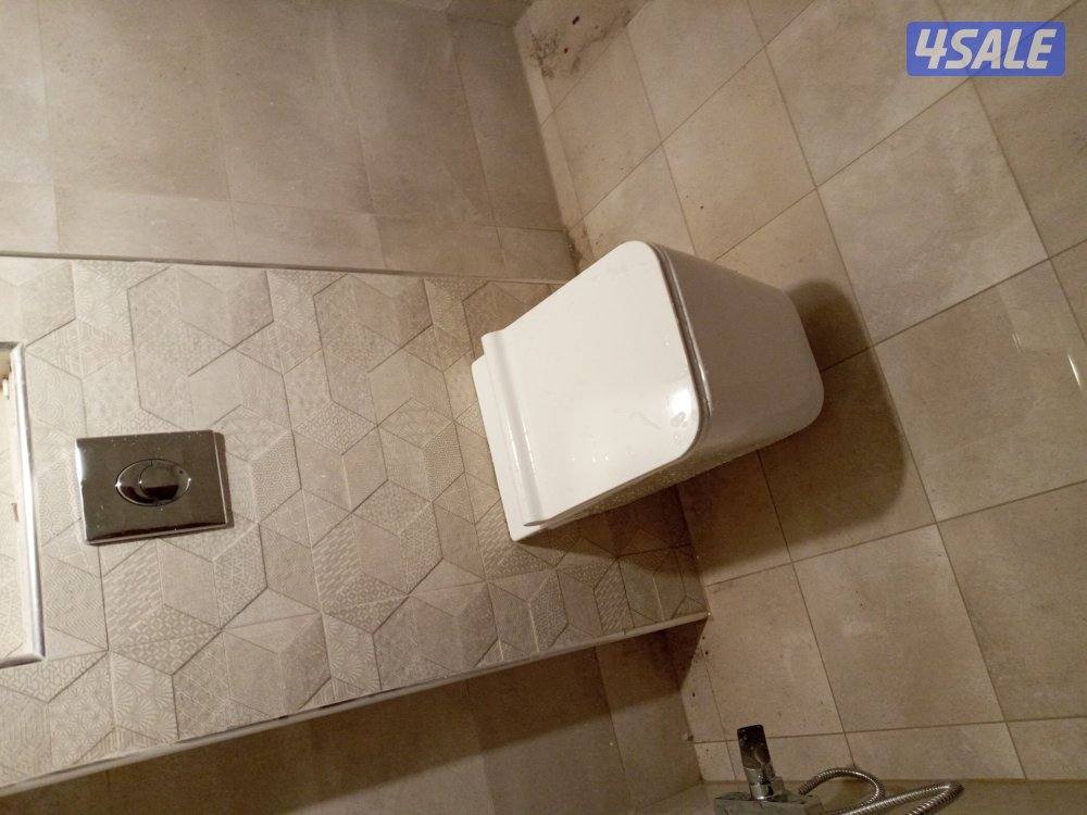 فنى صحى صيانة الحمامات وتمديد وتشطيب وتركيب وتبديل السخان وتكسير وتمدي0