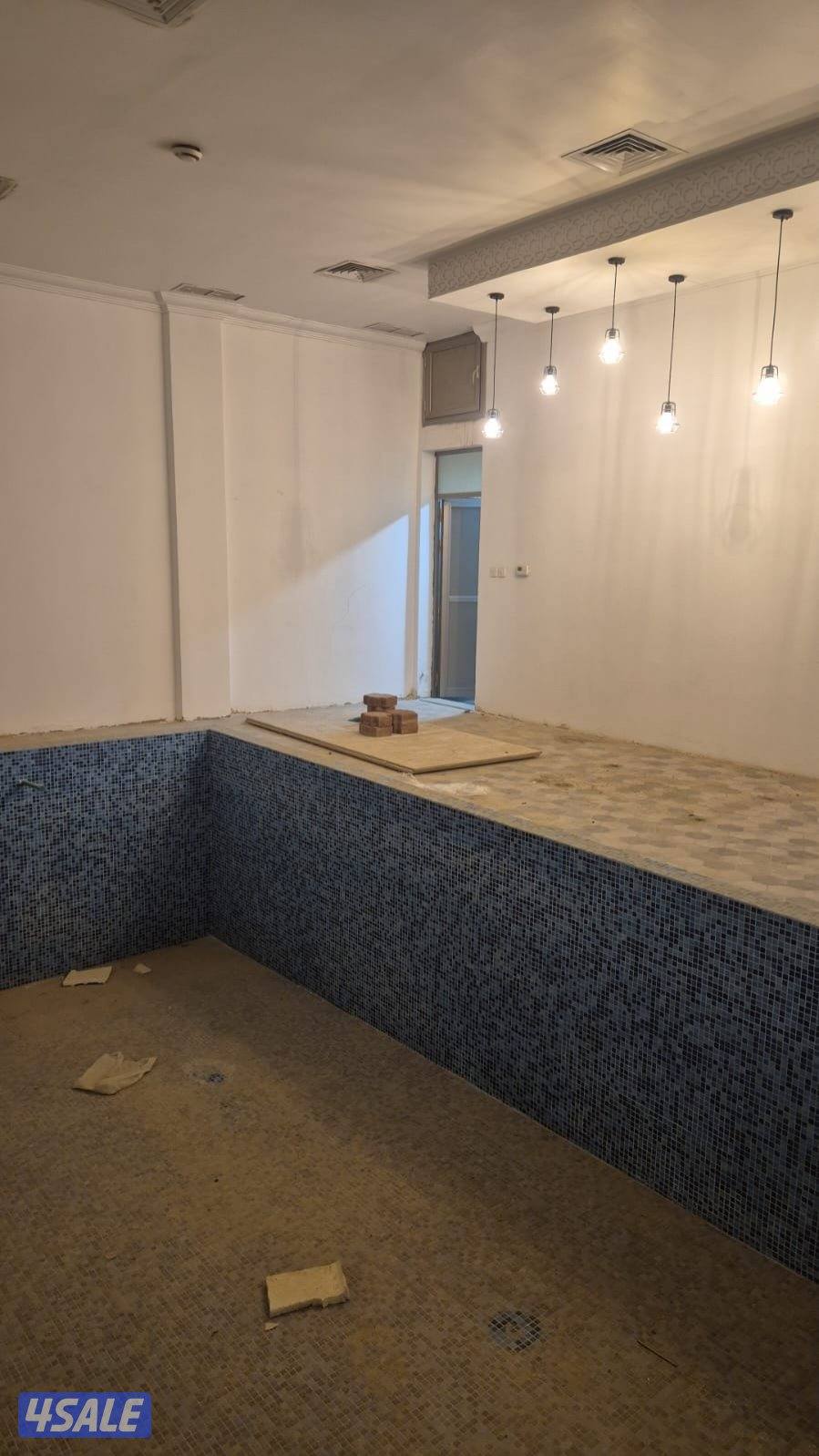 للبيع قسيمه بصباح الأحمد تشطيب ديلوكس دورين ونص درجين ومصعد فاضيه2