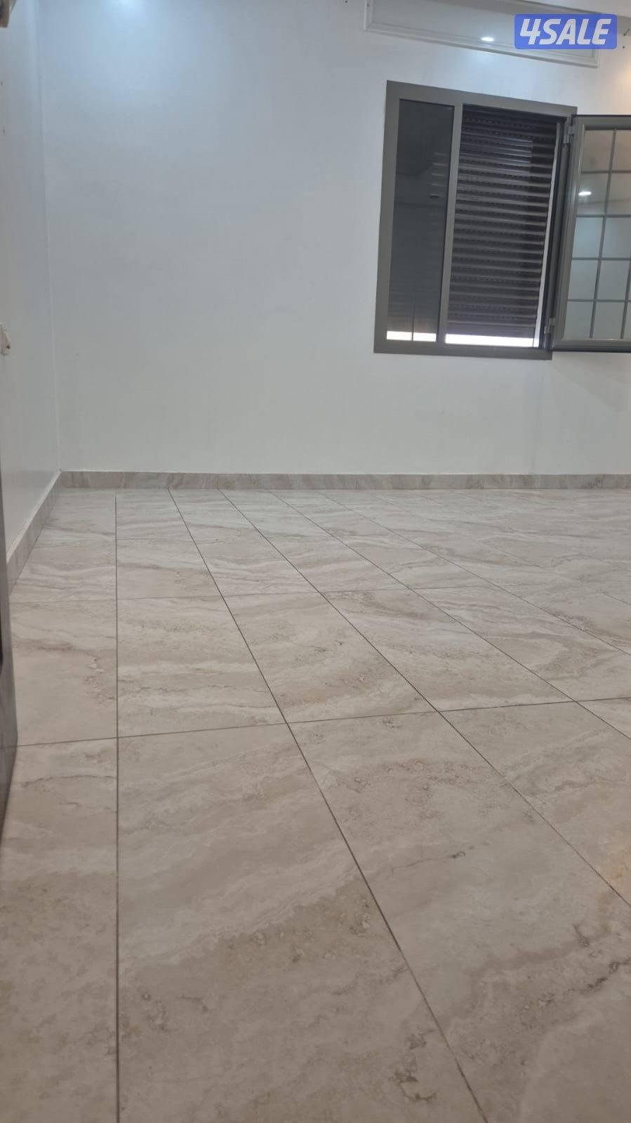 للبيع قسيمه بصباح الأحمد تشطيب ديلوكس دورين ونص درجين ومصعد فاضيه11