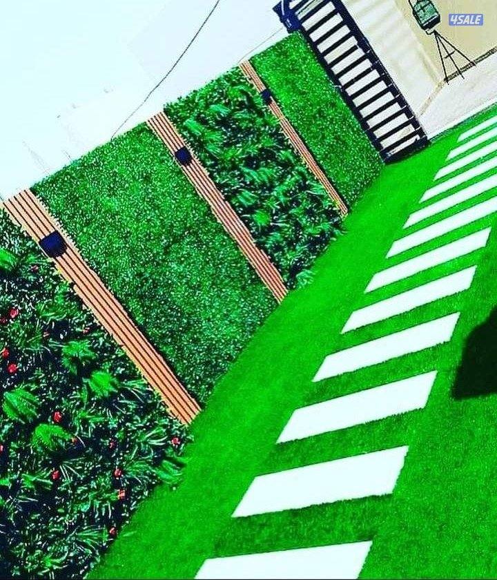 تنسيق حدائق زراع التيل الطبيعي وتركيب التيل الصناعي وقص الشجار الضخمه11