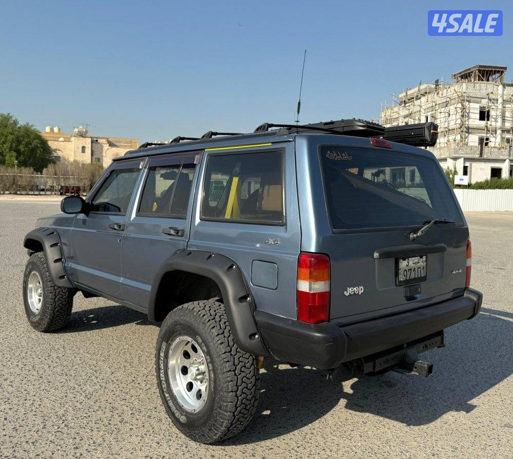 بحالة ممتازة جيب شروكي 1997 قير اتوماتيك دبل قير مجهز رحلات مسجل بدفتر4