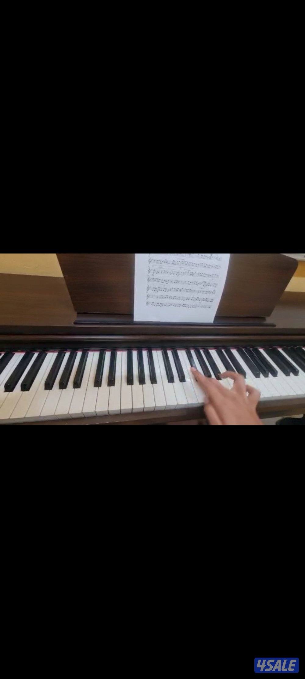 تعليم العزف لآله العود والبيانو لطلبةالمعهدوالتربية الاساسية1