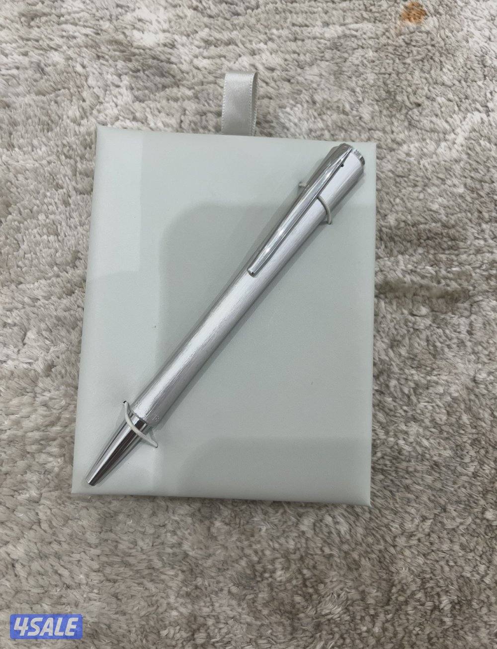 قلم وساعة من ماركة شيروتي الإيطالية ( أصل وليس تقليد ) في حالة جيده1