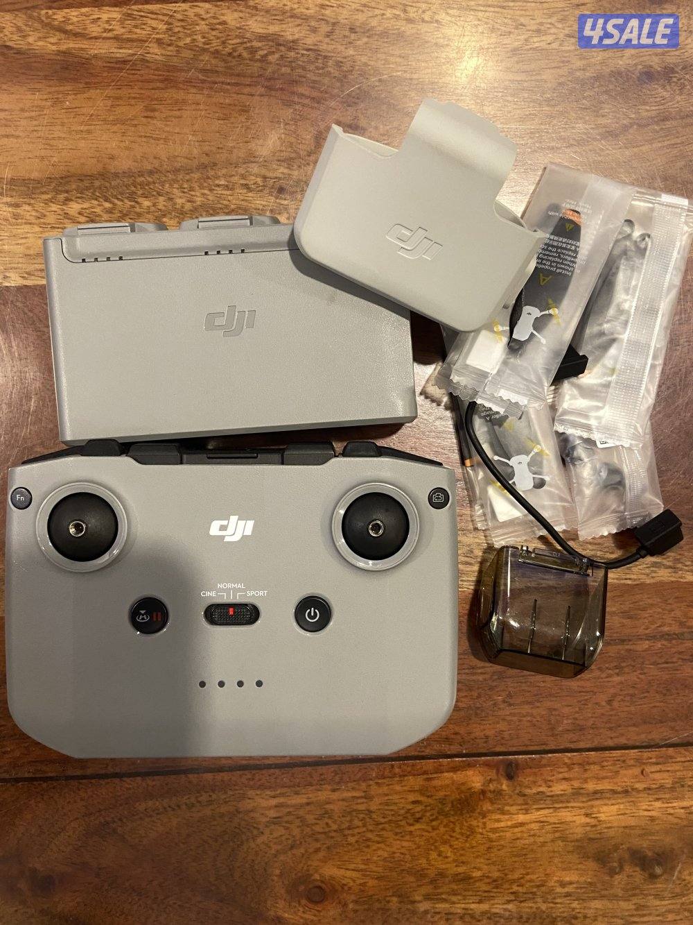 ريموتDJI mini 2 معه حامل البطاريات بطاريتين متوفرين0