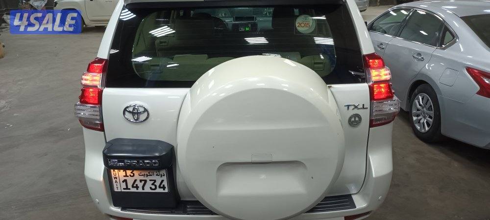 للبيع برادو 2015 شرف الفحص جير مكينة شاصي اللون ابيض نضيف جداً1