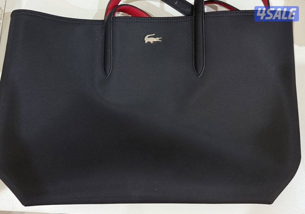 جنطة لاكوست اصليه " استعمال مرتين"0