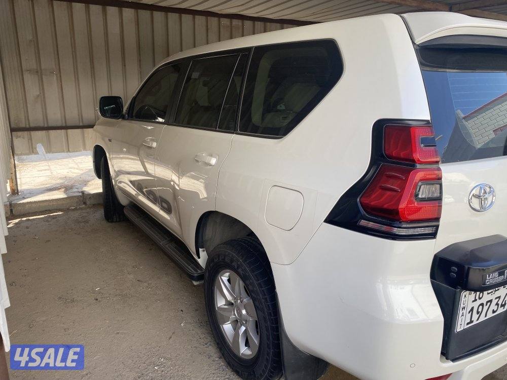 برادو ابيض موديل 2018 ماشي (112000) كم٢ شرط الفحص1