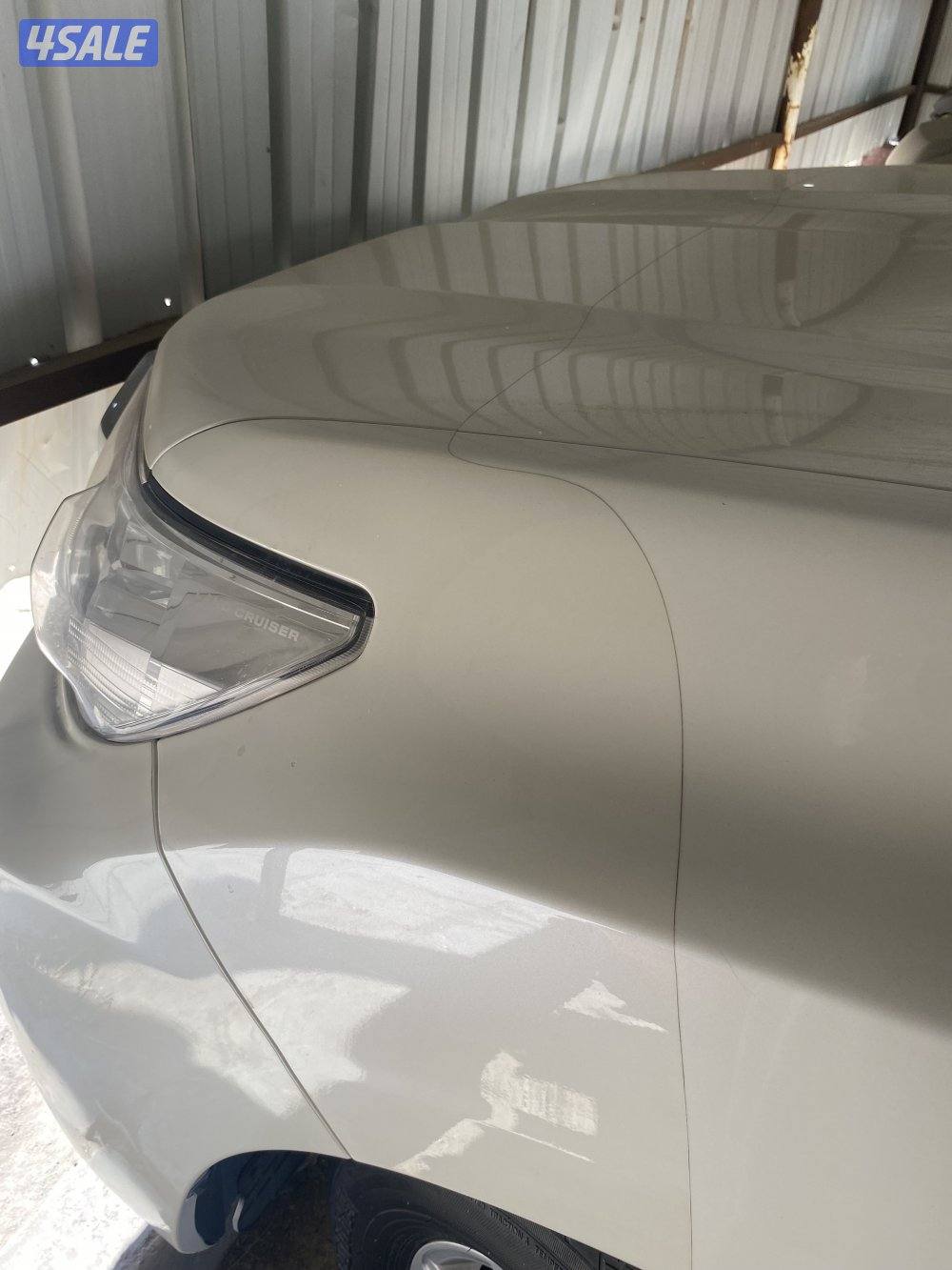 برادو ابيض موديل 2018 ماشي (112000) كم٢ شرط الفحص9