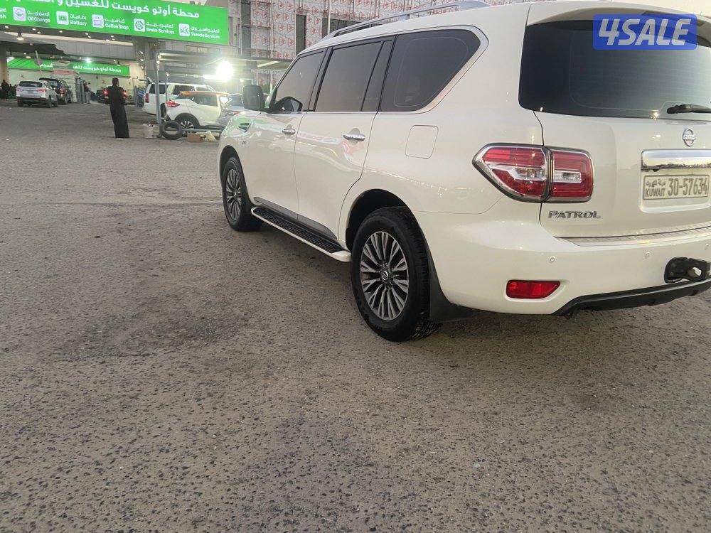 الروضة للبيع نيسان باترول 2015 بلاتينيوم قمة بنظافه داخل تان ممتازه3