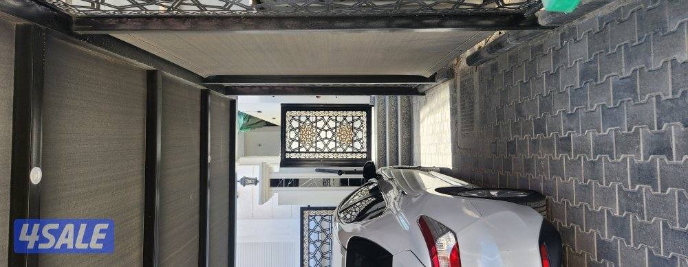 حداد ایراني مظلات سيارات  حديد مشغول ابواب درابزین بديل خشبي ،شبك2