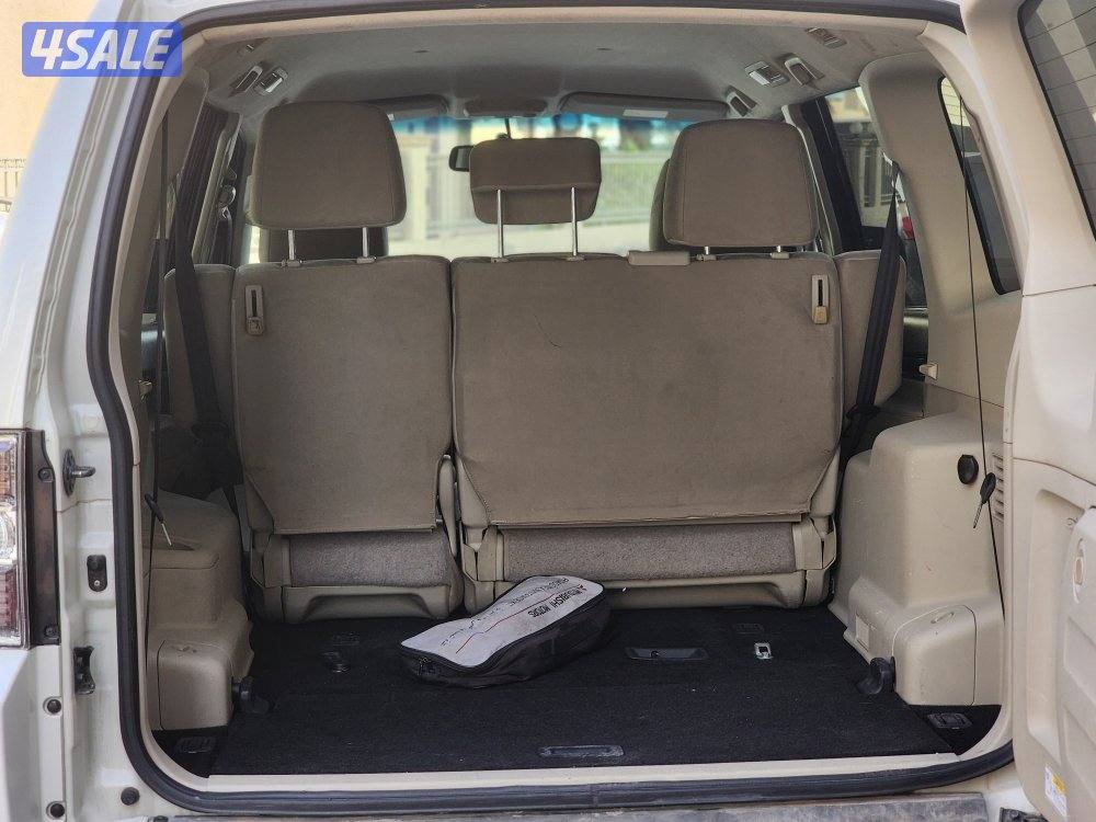 باجيرو موديل ٢٠٢٢ ماكينة صغيرة عداد 157 ألف أبيض صدفي شرط الفحص13