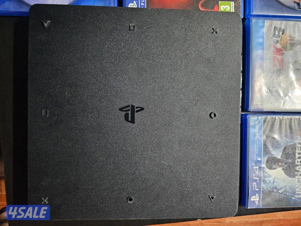 PS4 slim 500gb with 8 games good condition price slightly negotiable2