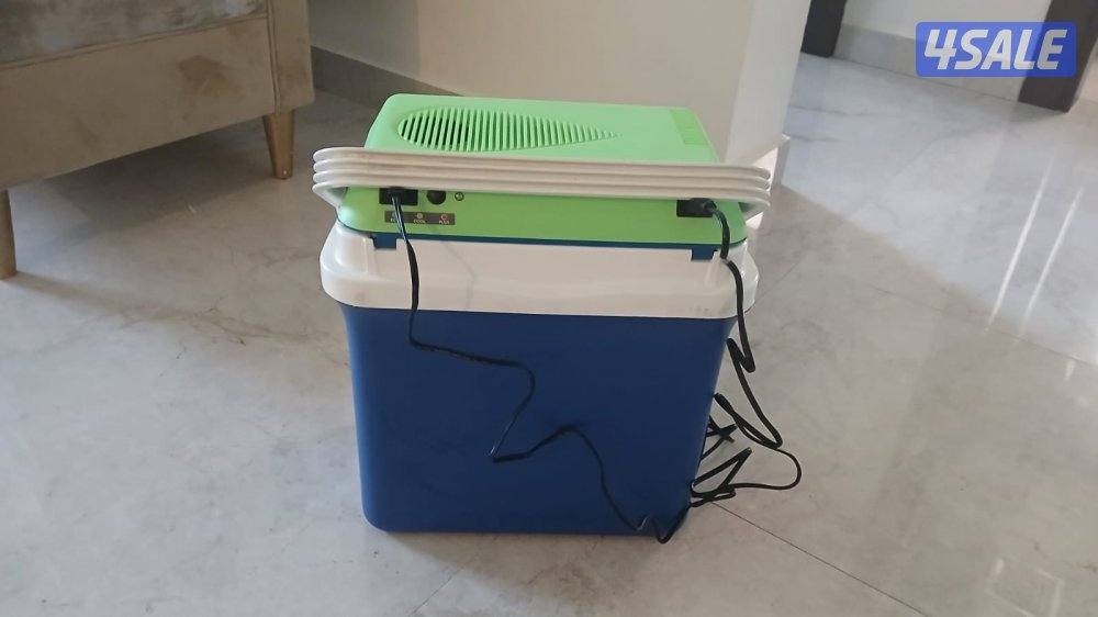 ثلاجه رحلات توصل بالسياره او البيت كهربا كالجديدة لم تستعمل الا مره1