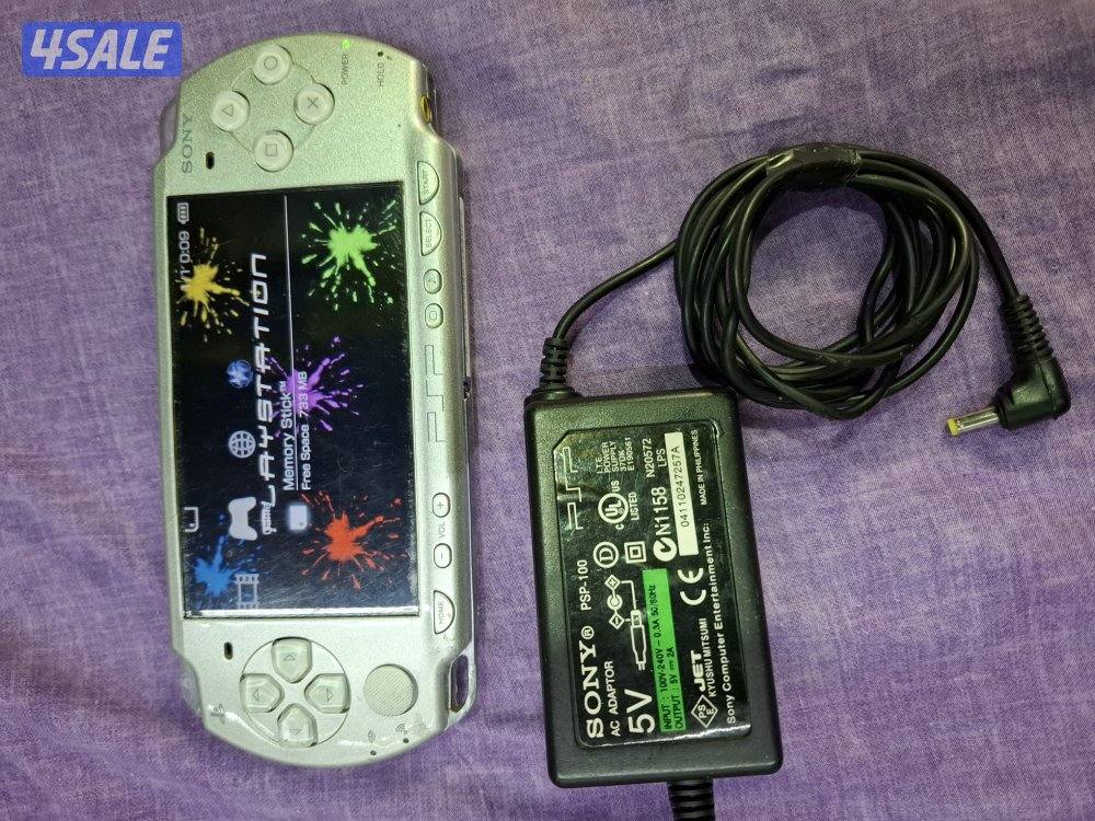 PSP SLIM P2000 MODEL..GREY COLOR 8GB SD CARD WITH 45 GAMES1
