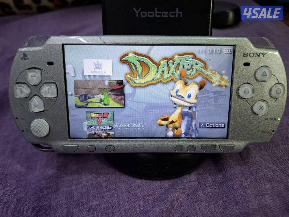 PSP SLIM P2000 MODEL..GREY COLOR 8GB SD CARD WITH 45 GAMES3