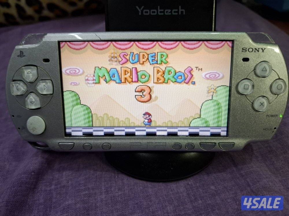 PSP SLIM P2000 MODEL..GREY COLOR 8GB SD CARD WITH 45 GAMES7