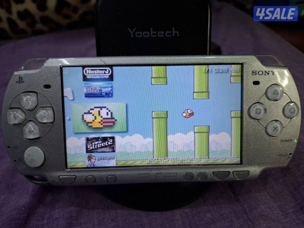 PSP SLIM P2000 MODEL..GREY COLOR 8GB SD CARD WITH 45 GAMES8