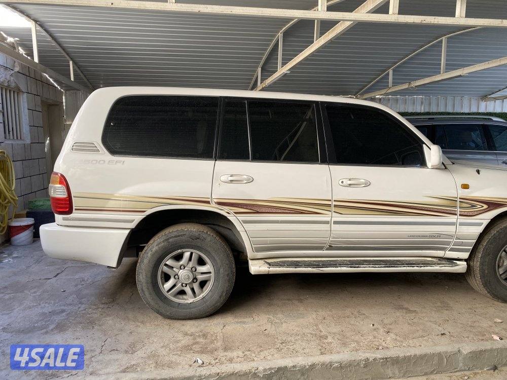 2003 بحاله جيده شاصي سليم قير عادي  ابيض من داخل بيج8