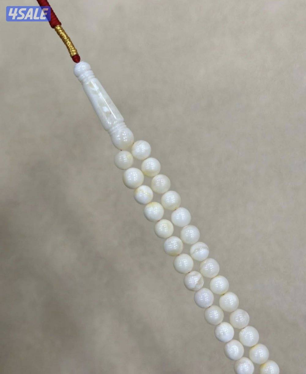 كهرب ابيض ٩٩ خرزه2