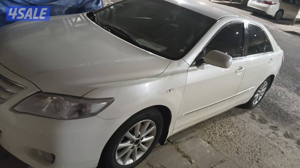 كامري 2010 ابيض صدفي glx0