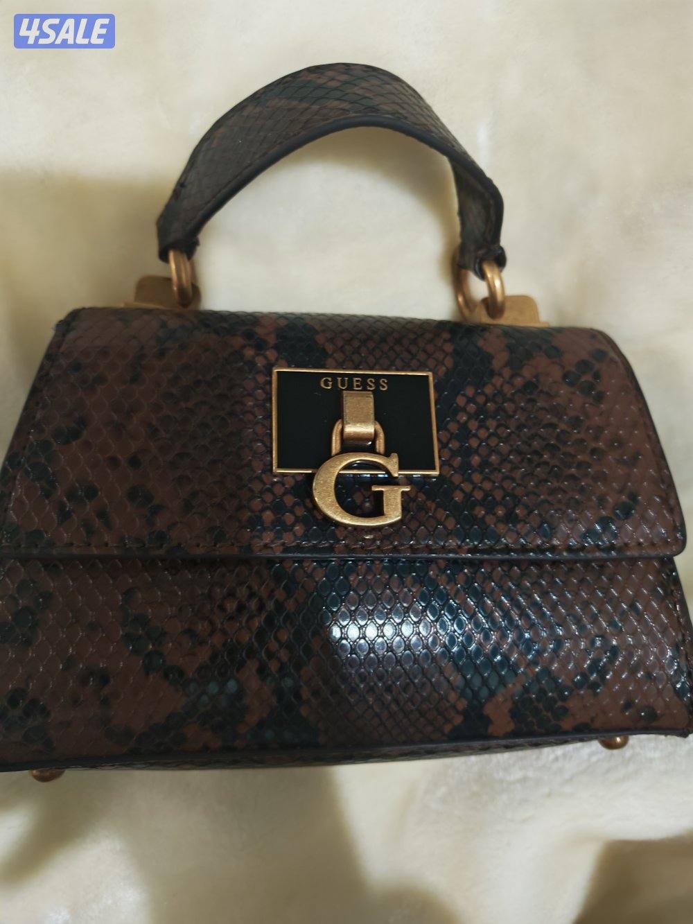 شنطة صغيرة جميلة ماركة جس على شكل جلد الحيه2