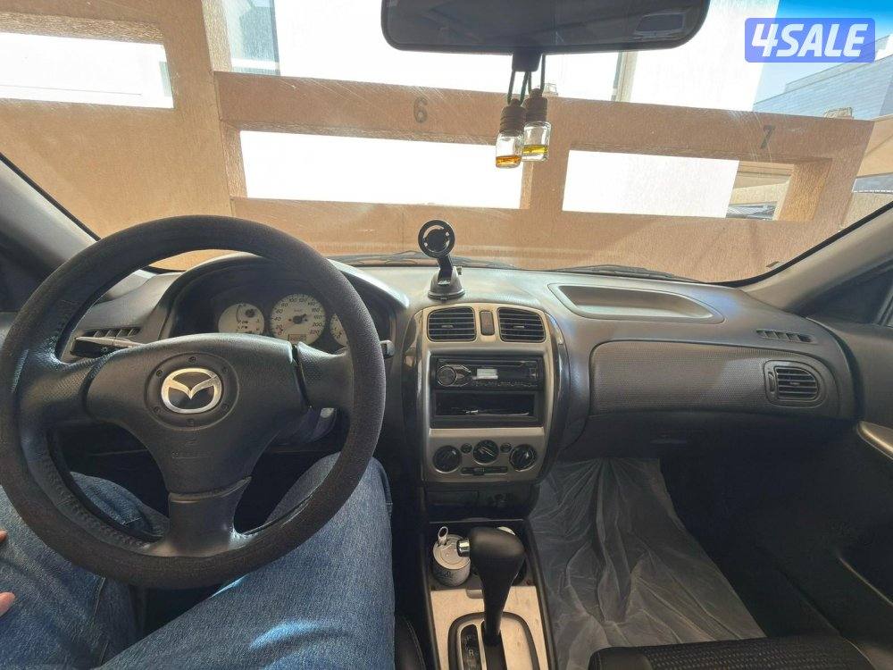 مازدا 323 سنة 2003 عداد 140 ألف بحالة جيدة و السعر قابل للنقاش4