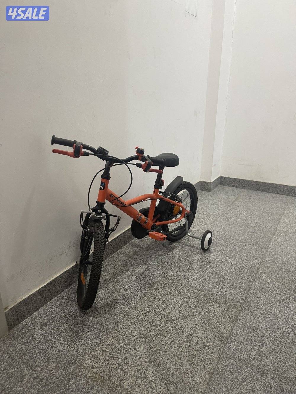 B’twin Orange bike - 25 KD - With training wheels - Almost New1