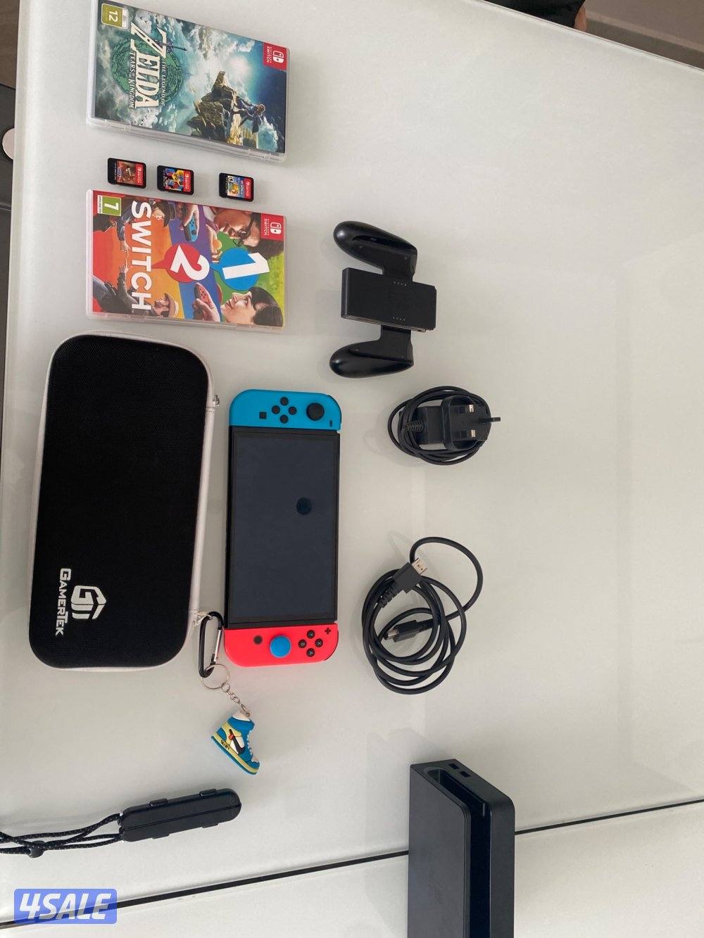 Nintendo Switch OLED Neon + 4 Games + Case – Excellent Condition1