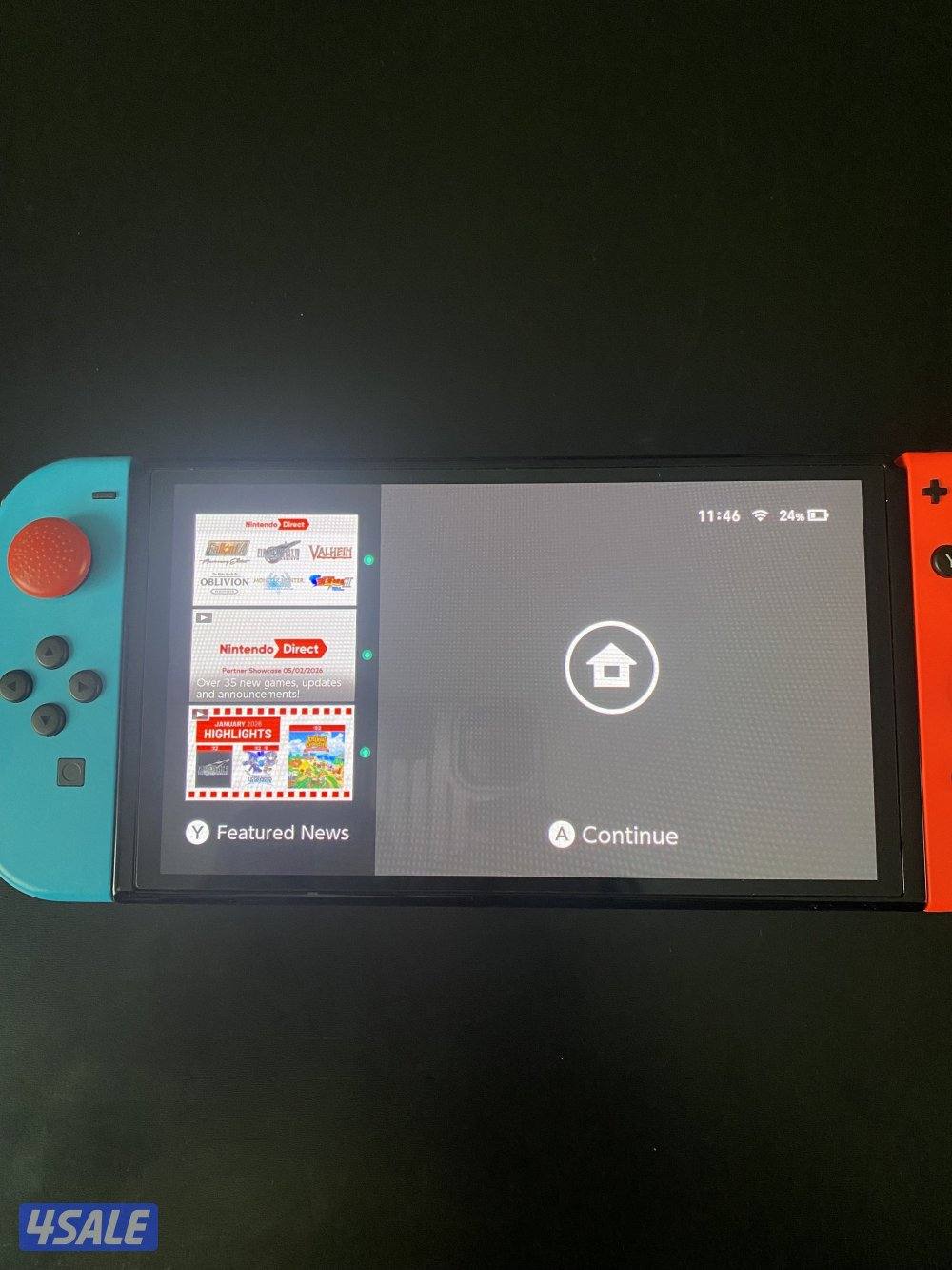 Nintendo Switch OLED Neon + 4 Games + Case – Excellent Condition2