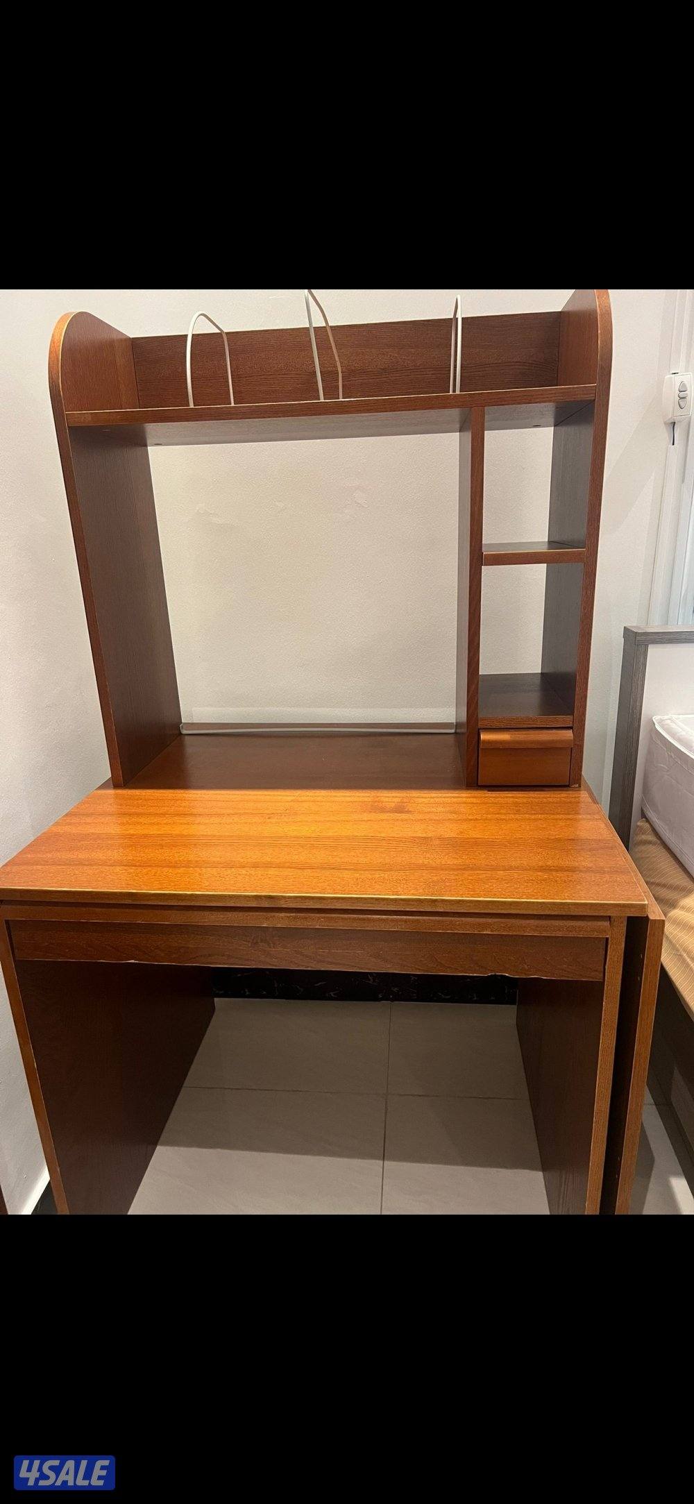 Desk has a side latch that opens making it wider0