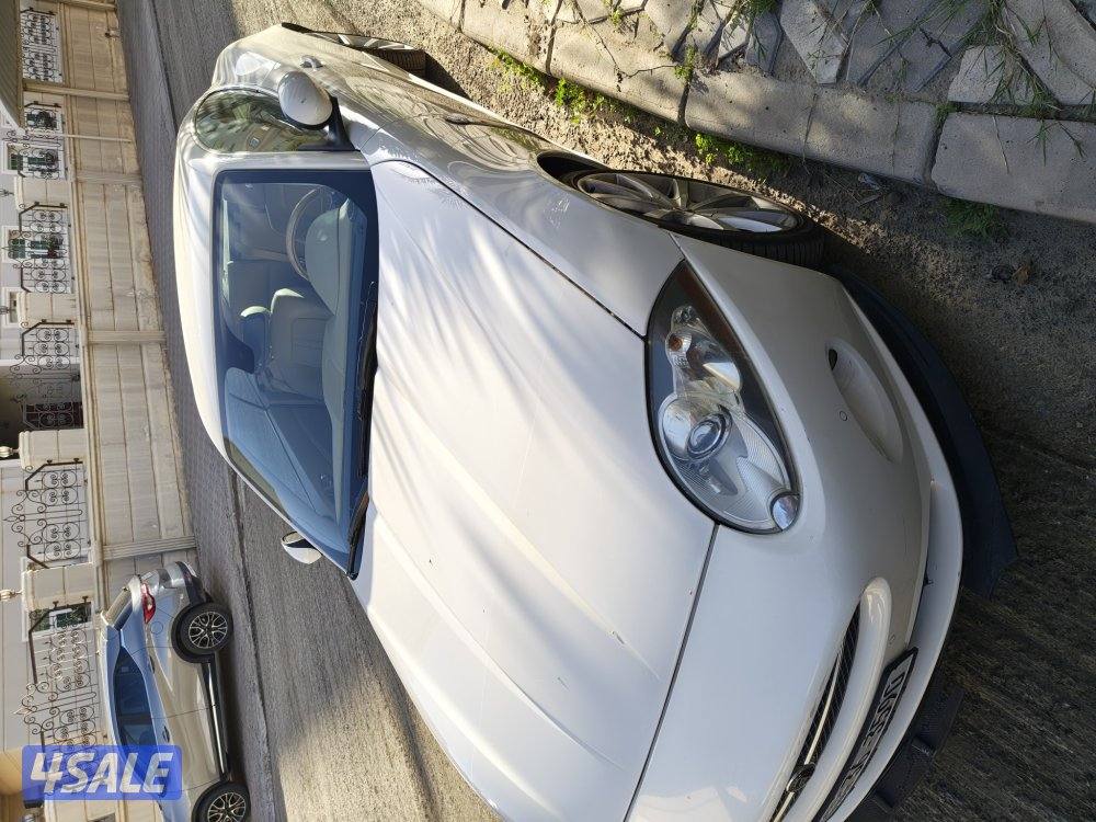 للبيع xk نضيف ماشى ١٣٥ الف اللون اليض3