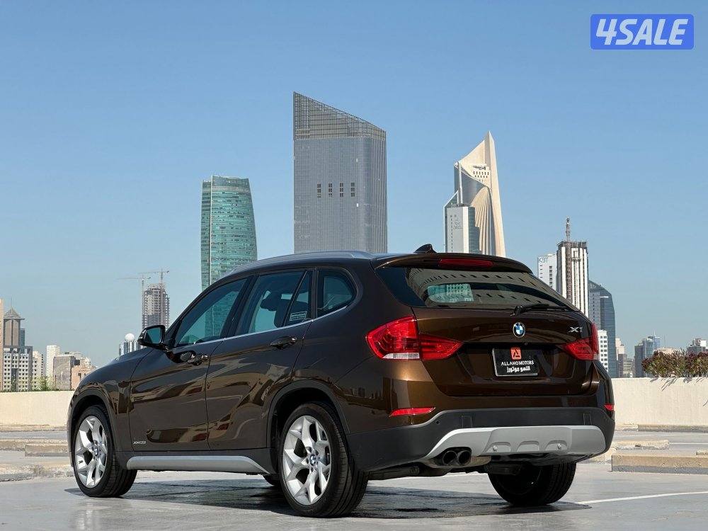 بي ام دبليوX1 موديل2015 عداد139الف وارد امريكا ملف +سيرفس في الغانم2