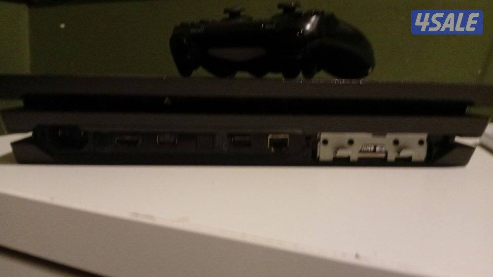 playstaion 4 pro with a controller in good condition with games2