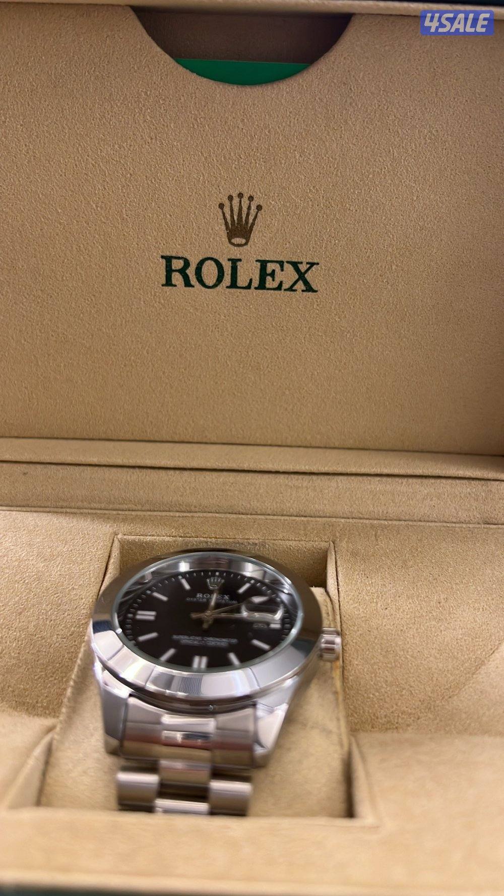 ساعة رولكس تقليد لاكن الكرتون اصلي الساعه نظيفه بشكل مو طبيعي1
