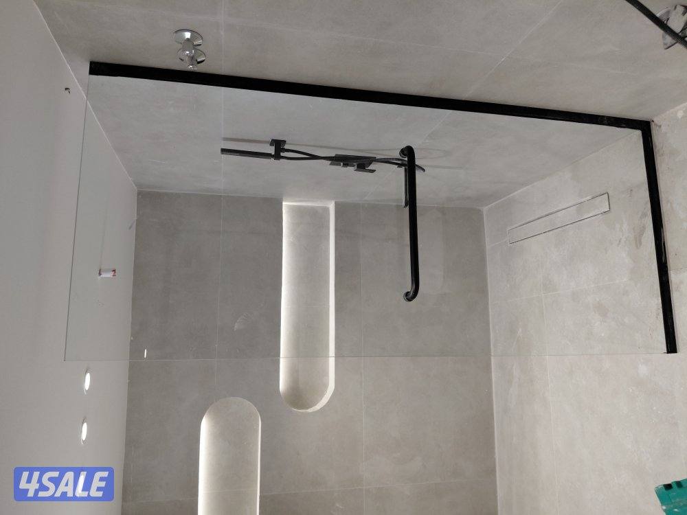 تركيب جميع اعمال الزجاج  شاور بوكس _دربزين _واجهات زجاج_ مرايا_ قواطع4