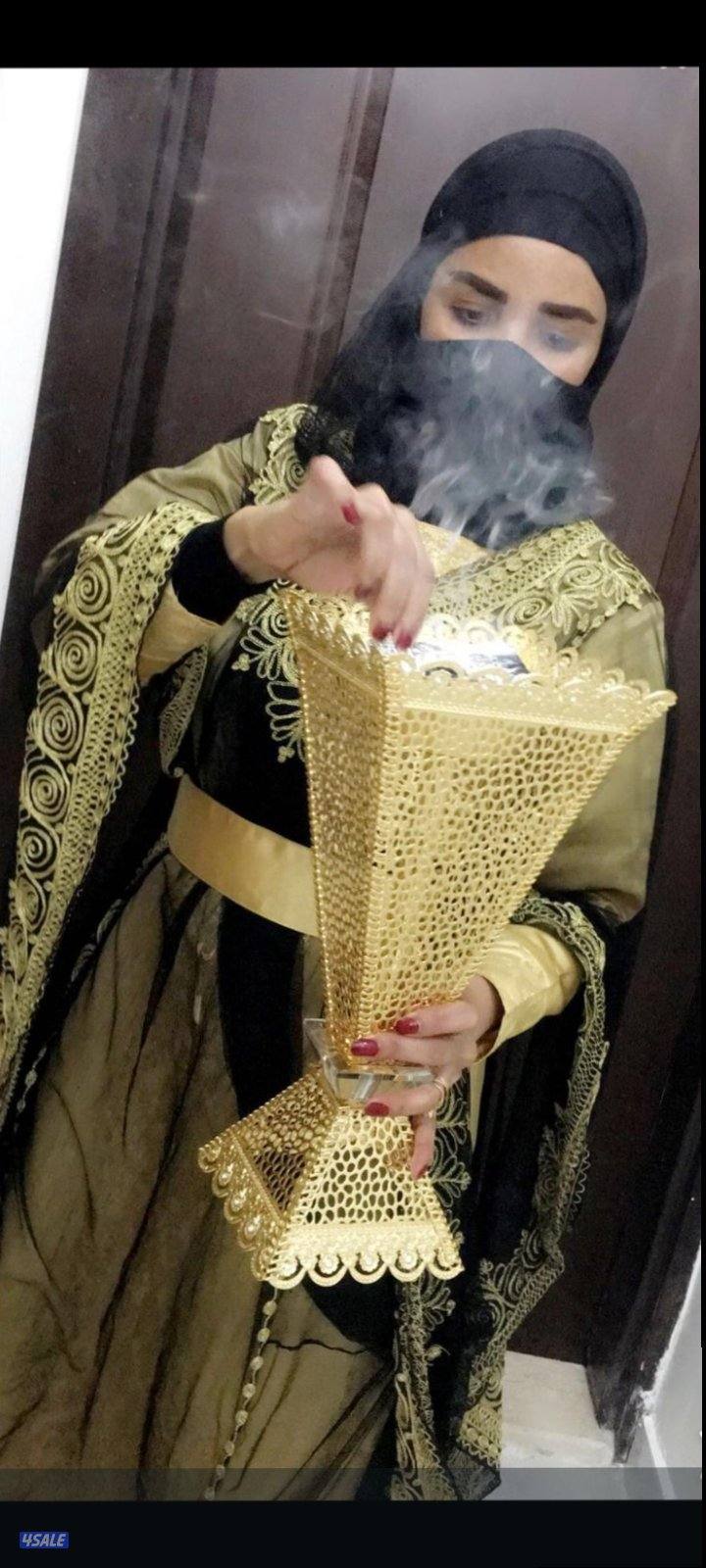 تقديم التمور والقهوة العربي بالزي الرسمي11