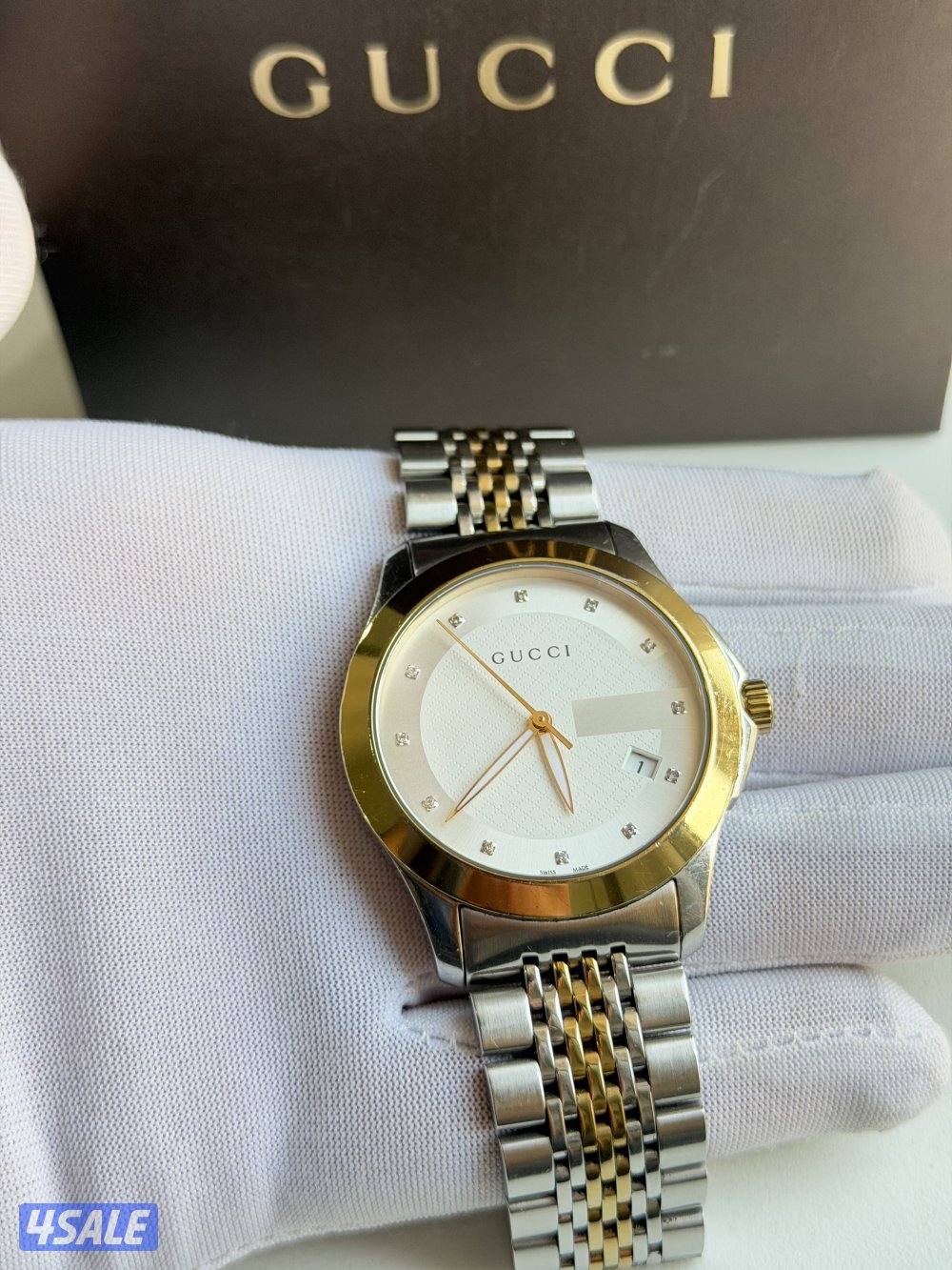 ساعة قوتشي الاصلية2